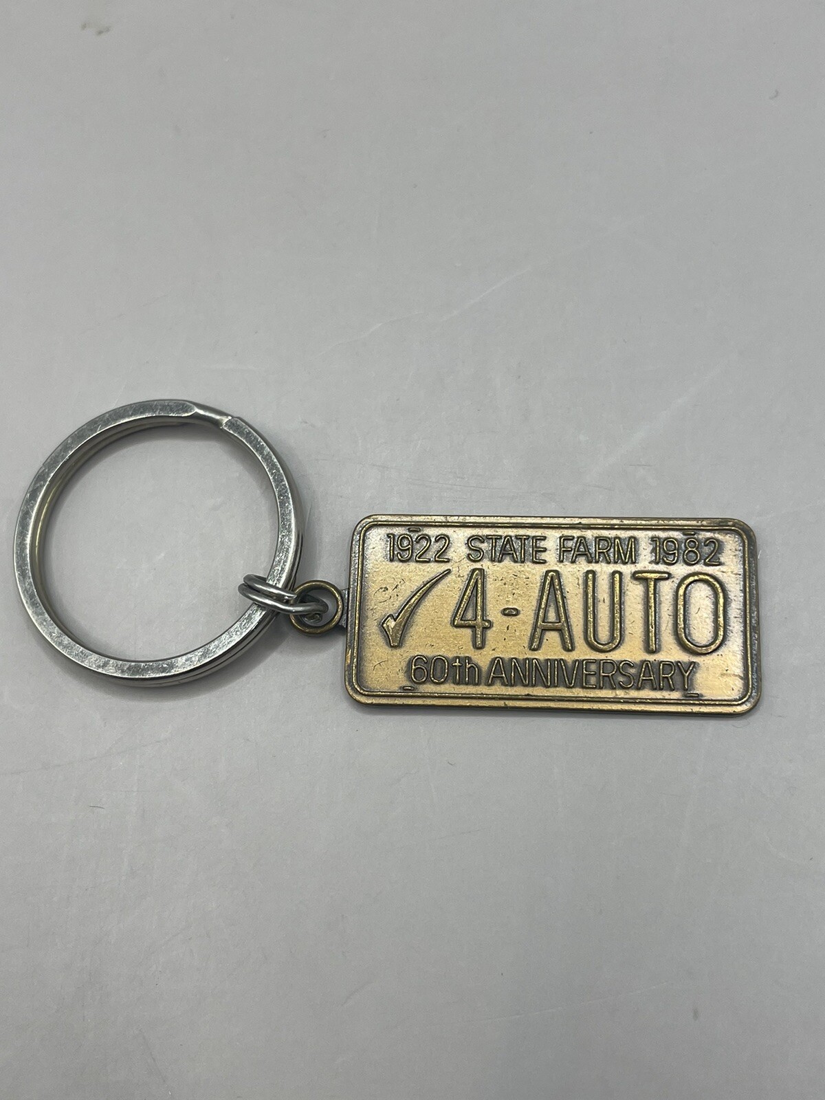 1982 State Farm 60th Anniversary “4-AUTO” License Plate Metal Keychain-2.5″ Long