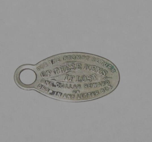 Wolcott Insurance Agency, St.Paul St, Baltimore MD~Metal Key Fob Return Reward