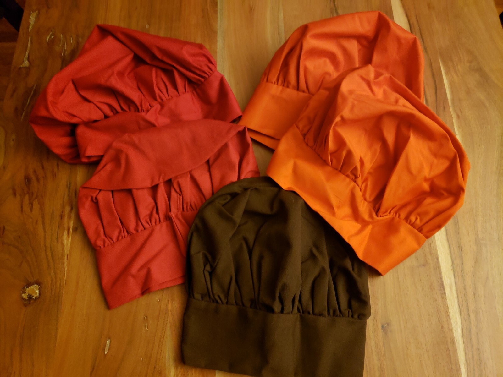 Five Chefs Hats Never Worn Two Orange Two Red One Brown
