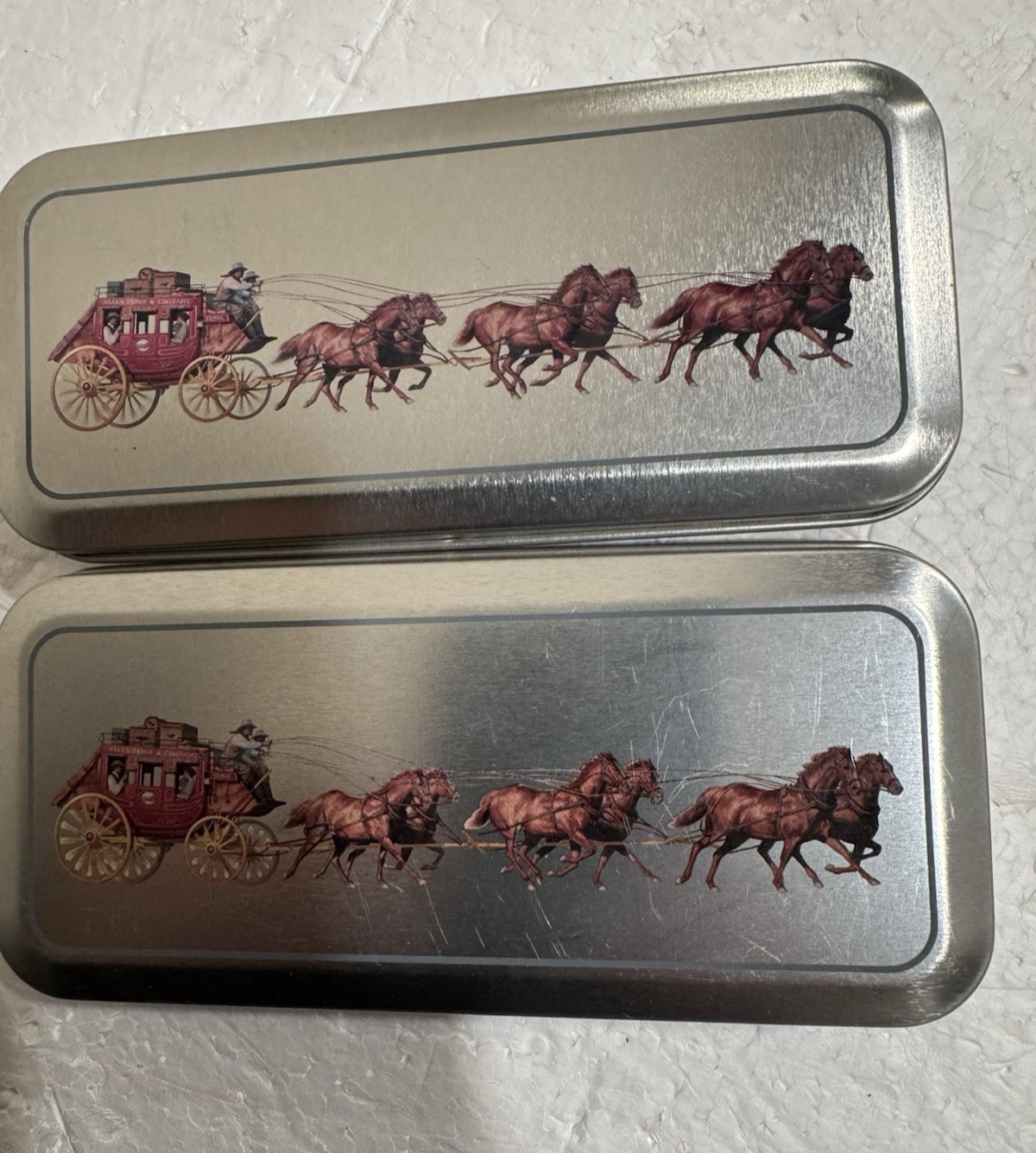 2 Lot VTG Wells Fargo Advisors Silver Tins w/ Stagecoach & Horses Design & Pens