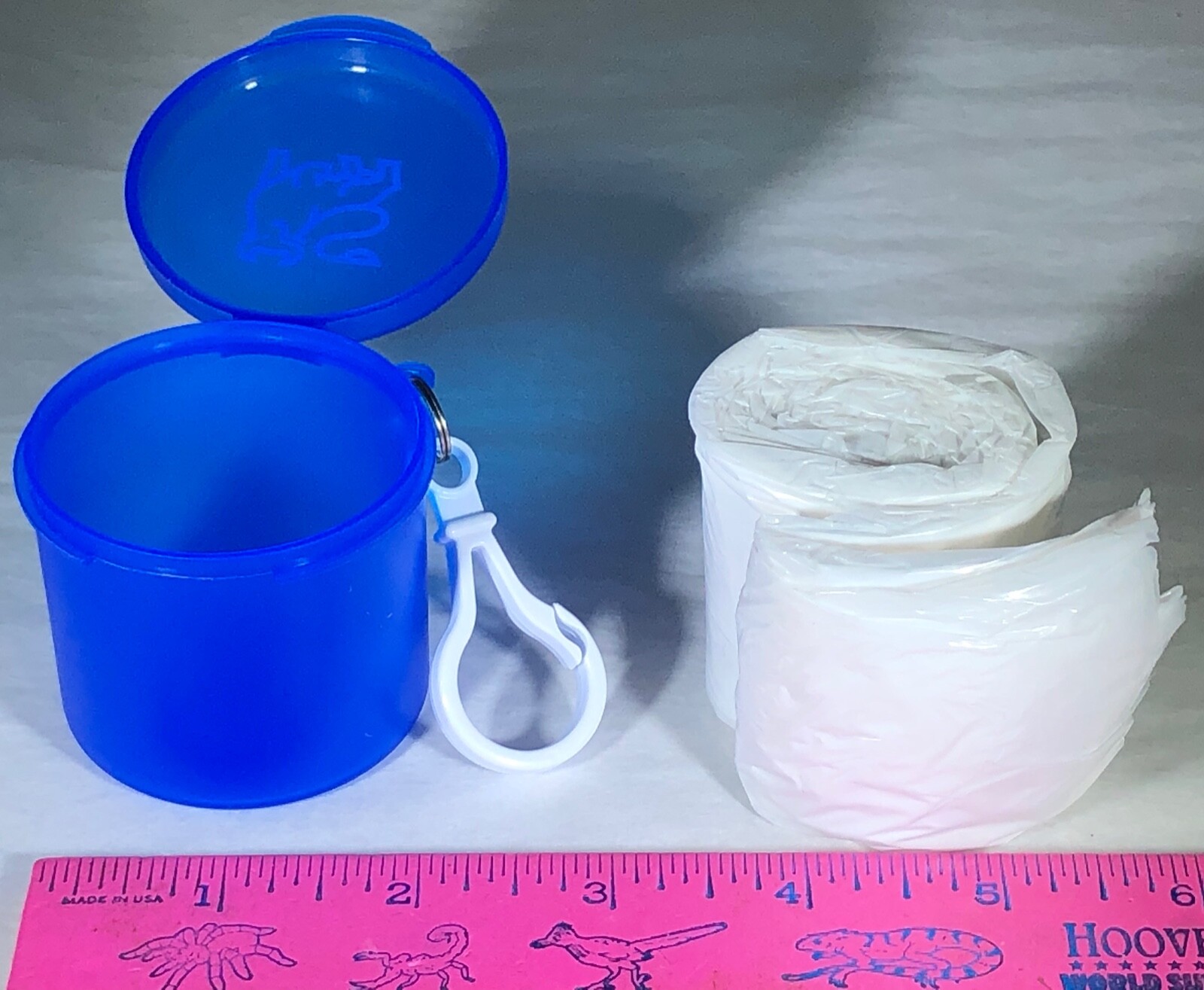 POCKET RAIN PONCHO IN BLUE PLASTIC CASE WHITE CARABINER MERRILL LYNCH BULL LOGO