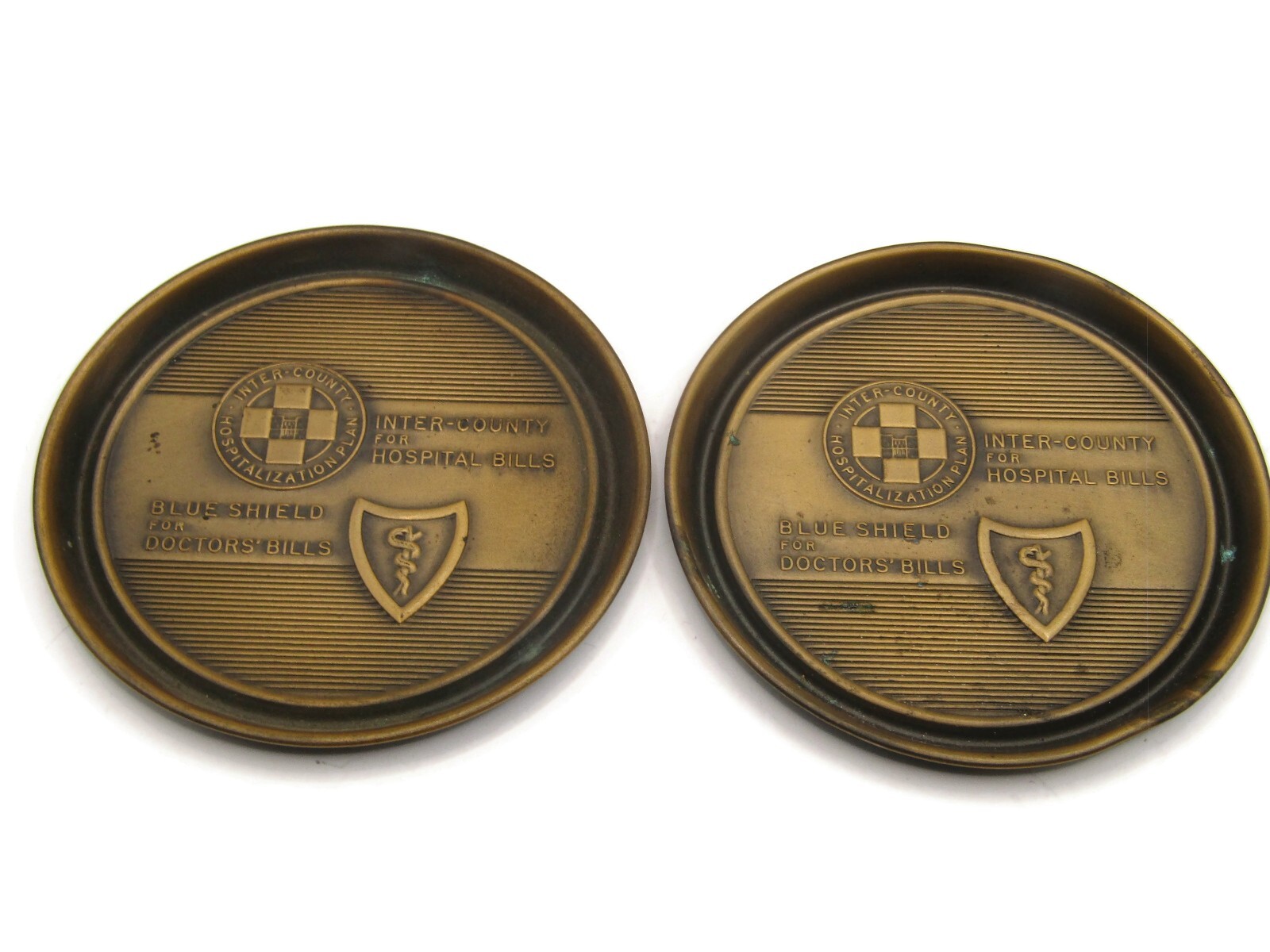 Vintage Pair Blue Shield Inter-County Hospital Plan Brass Tone Metal Coasters