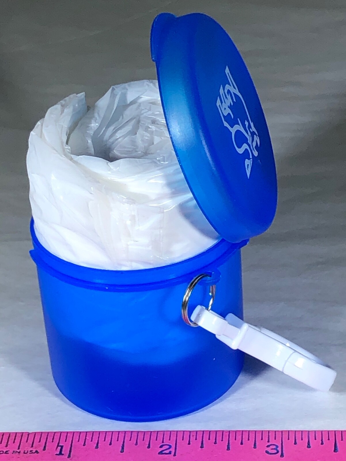 POCKET RAIN PONCHO IN BLUE PLASTIC CASE WHITE CARABINER MERRILL LYNCH BULL LOGO