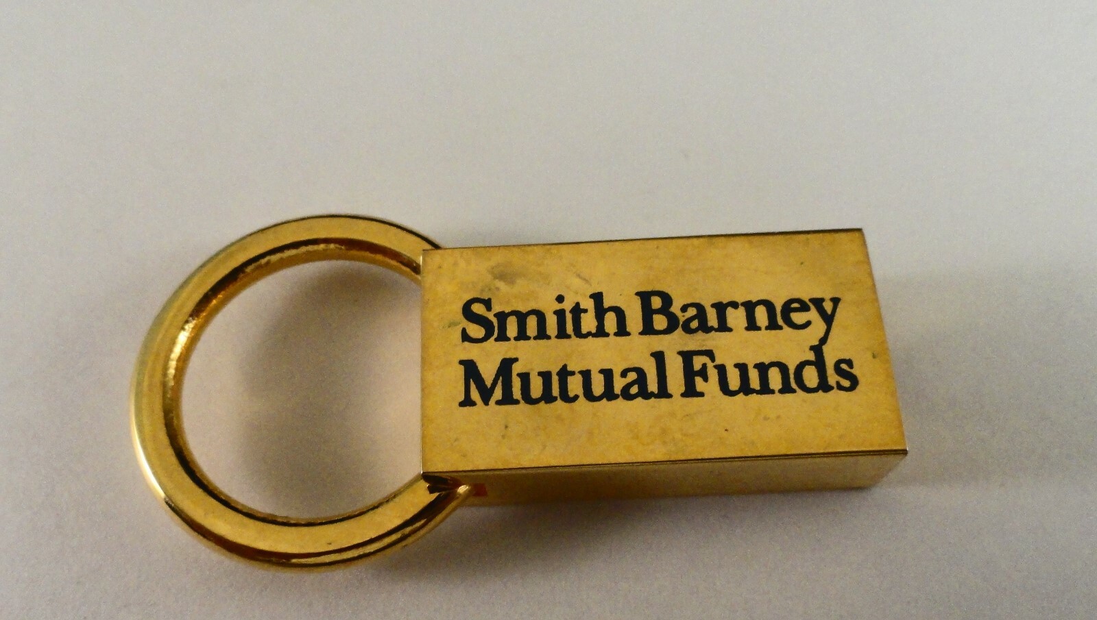 Two Metal Key Holders: Smith Barney & Calumet Financial Associates