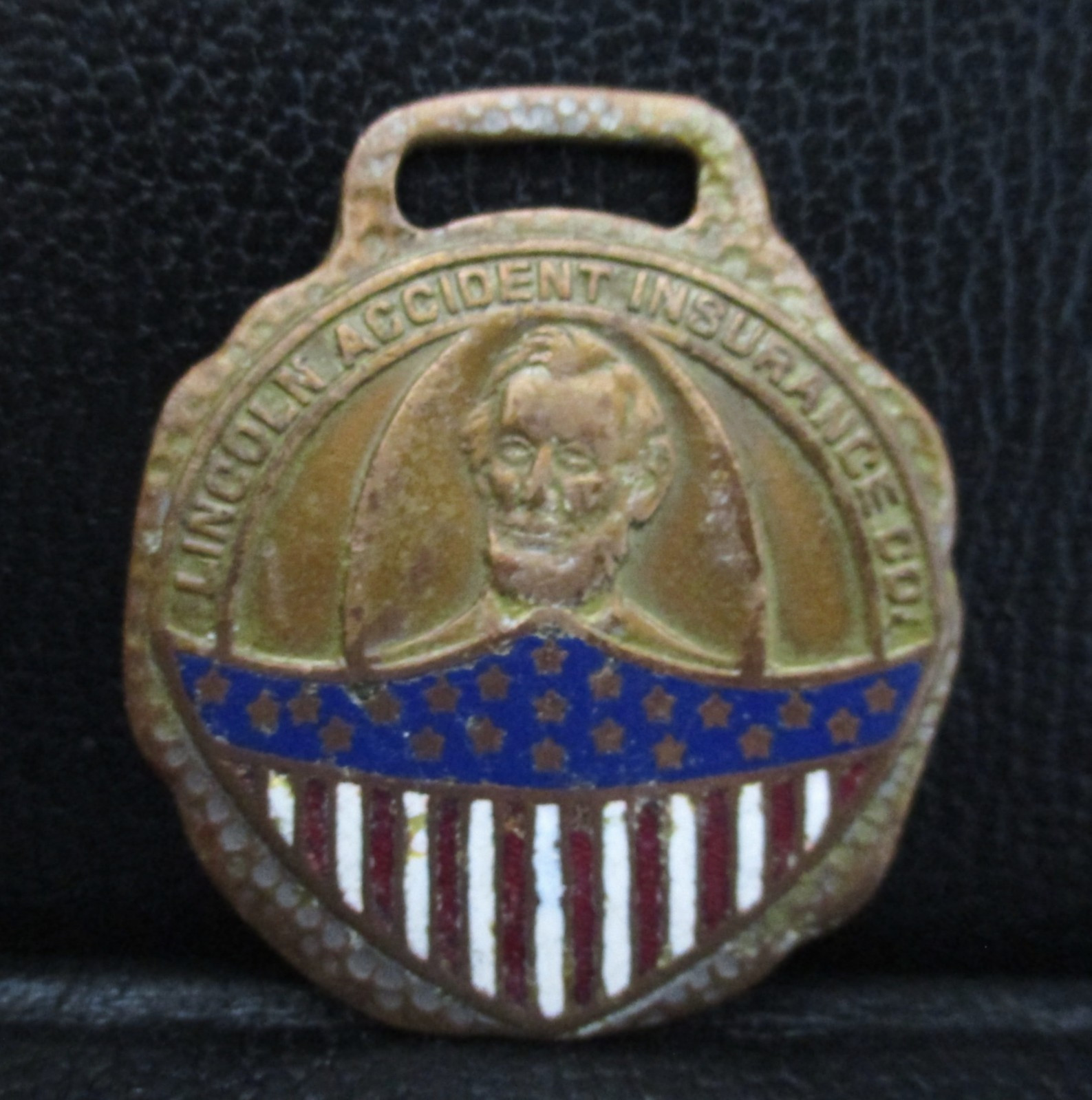 Lincoln Accident Insurance Company NE Abe & USA Flag Shield Watch Fob Green Duck