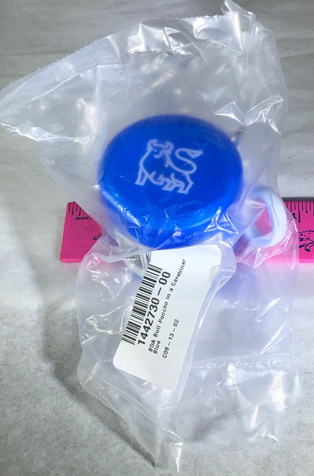 POCKET RAIN PONCHO IN BLUE PLASTIC CASE WHITE CARABINER MERRILL LYNCH BULL LOGO